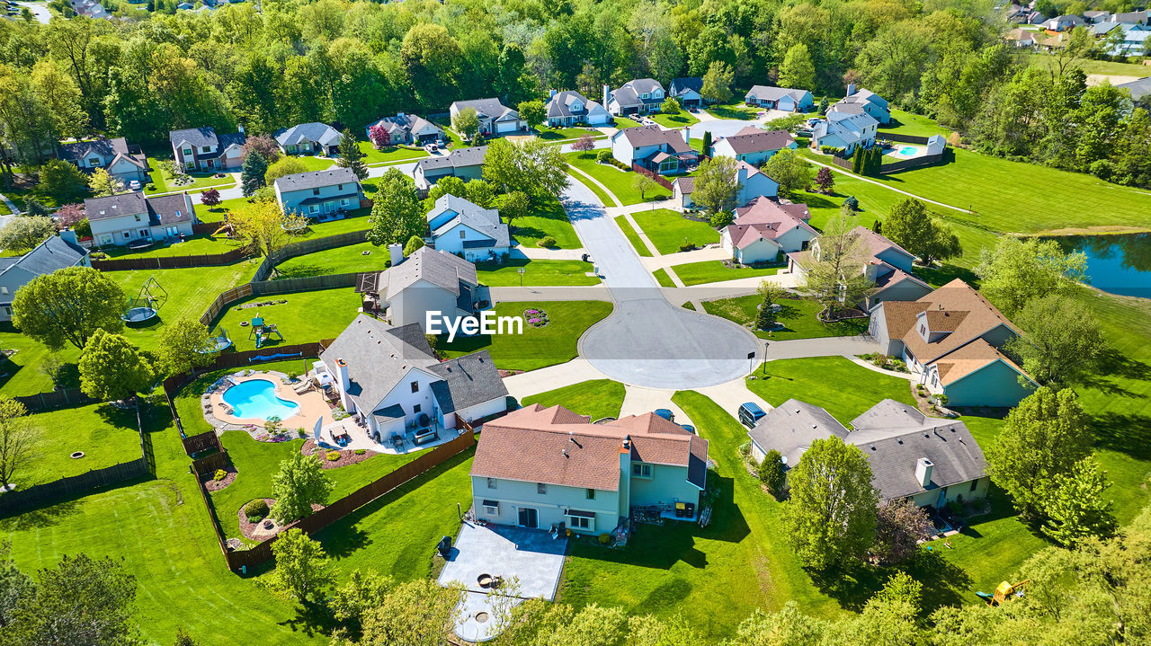 high angle view of trees and houses