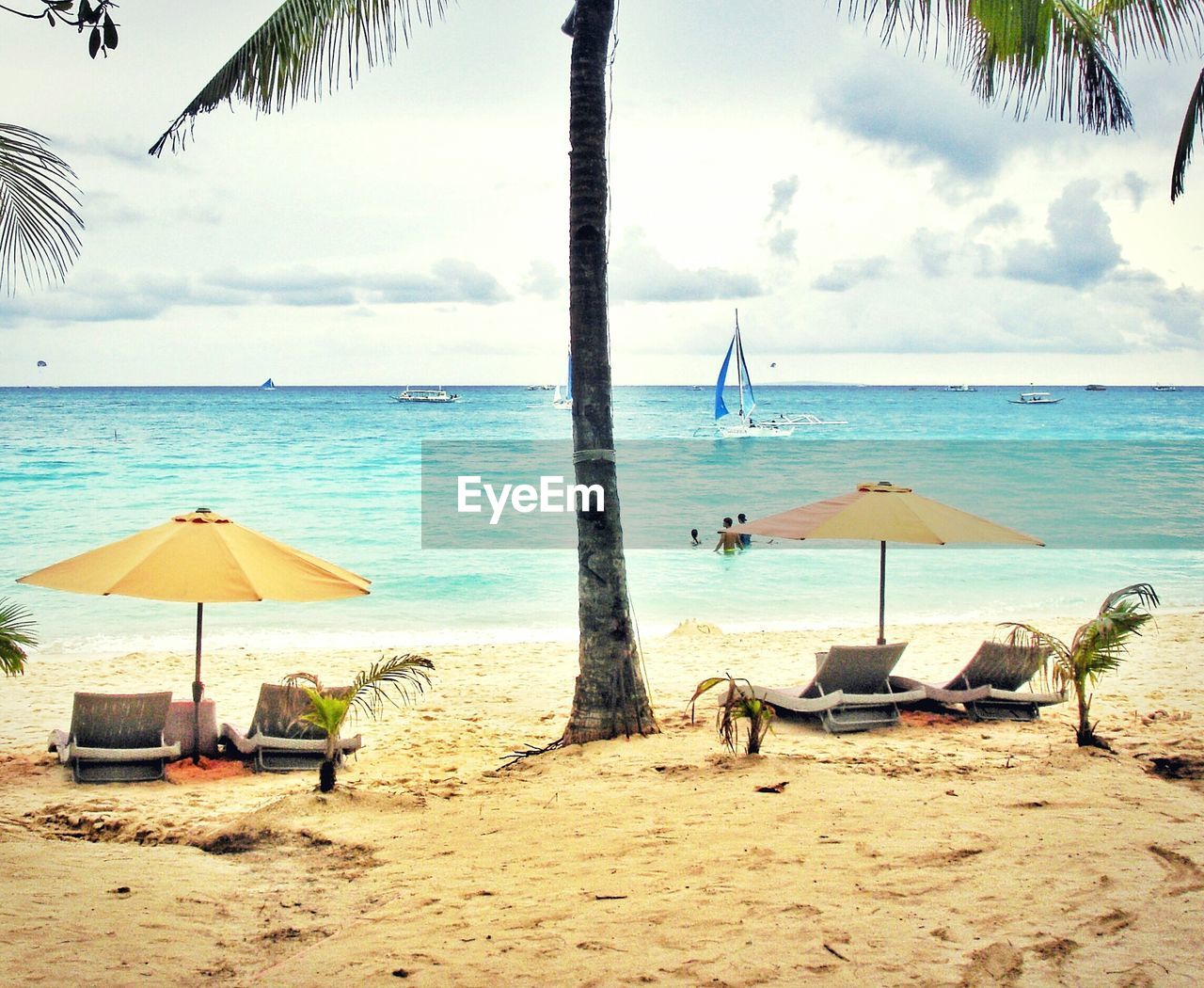 Scenic view of sandy beach against sky