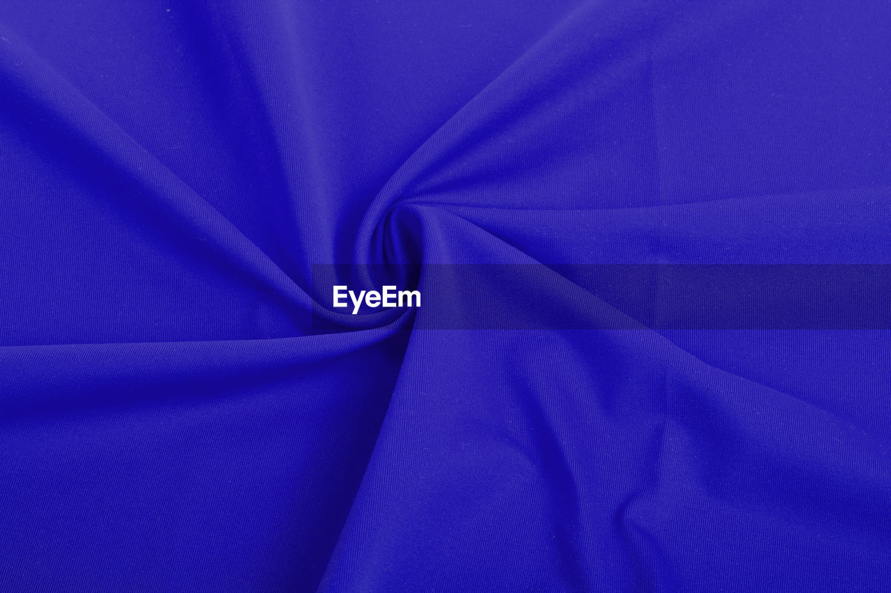 DIRECTLY ABOVE SHOT OF PURPLE BLUE FABRIC