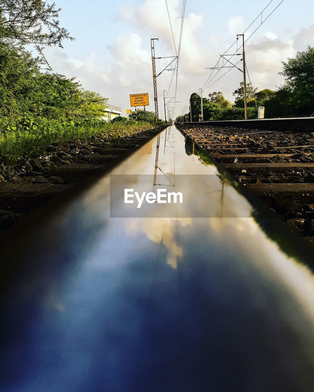 SURFACE LEVEL VIEW OF CANAL ALONG ROAD