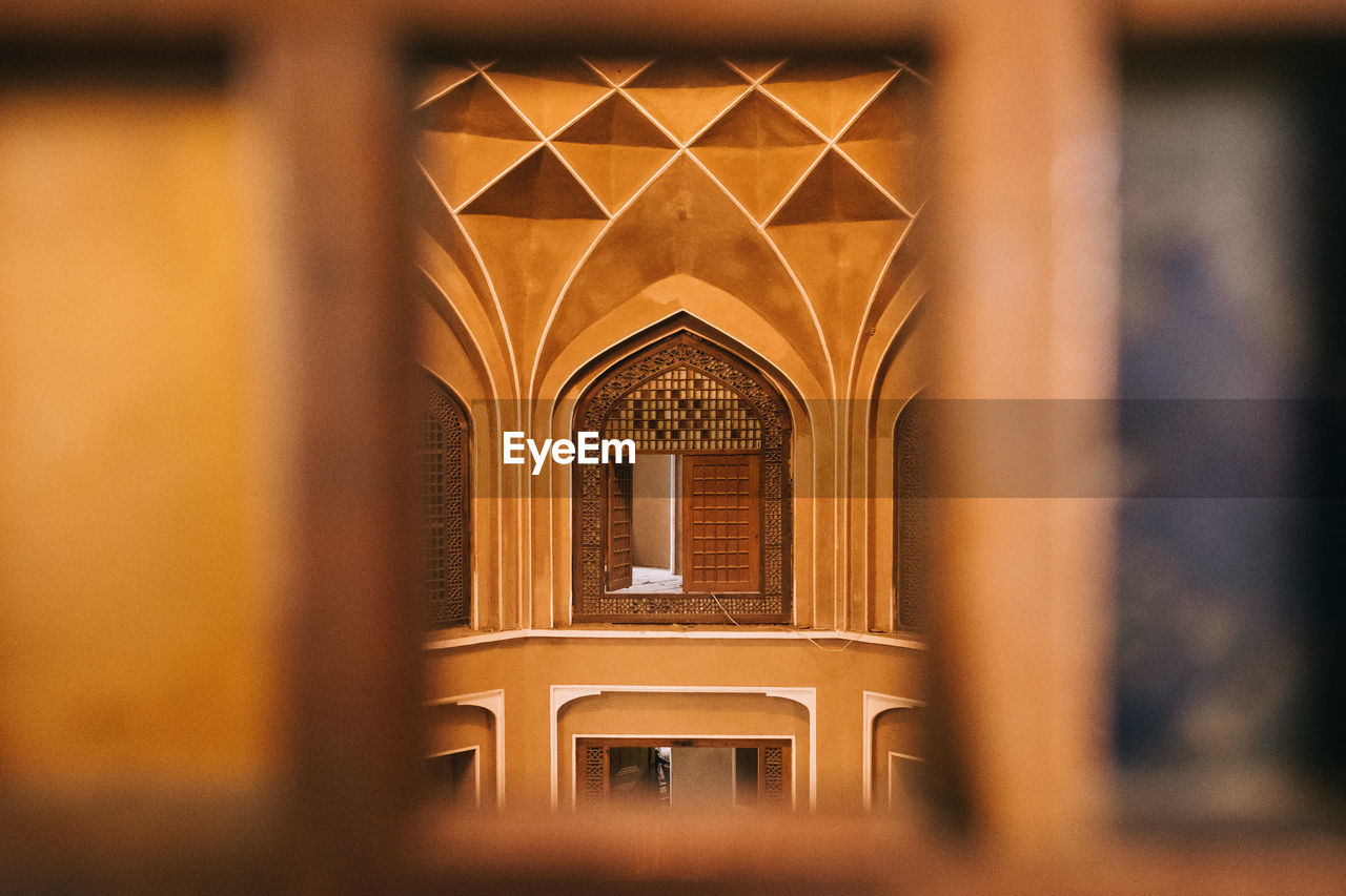 Historic building seen through window