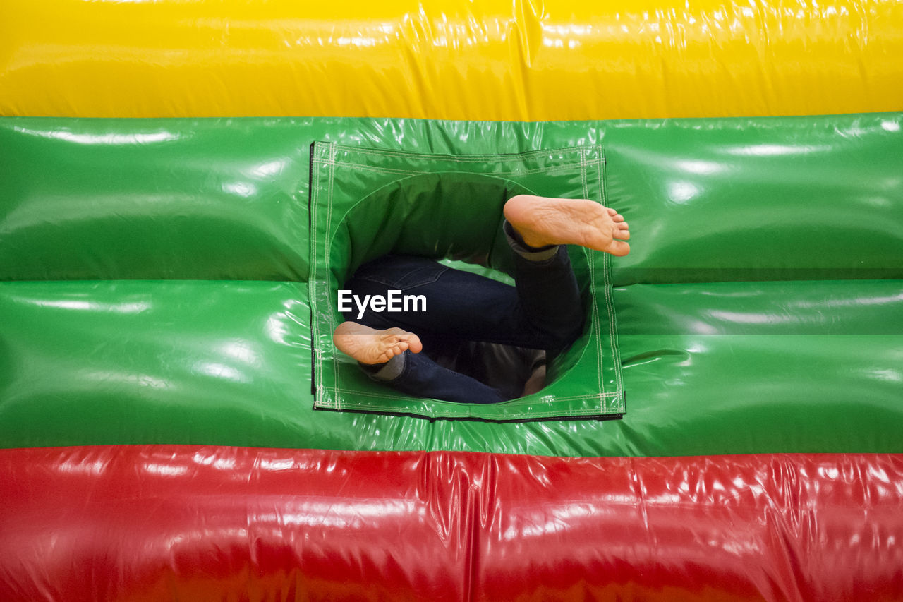Low section of child in bouncy castle