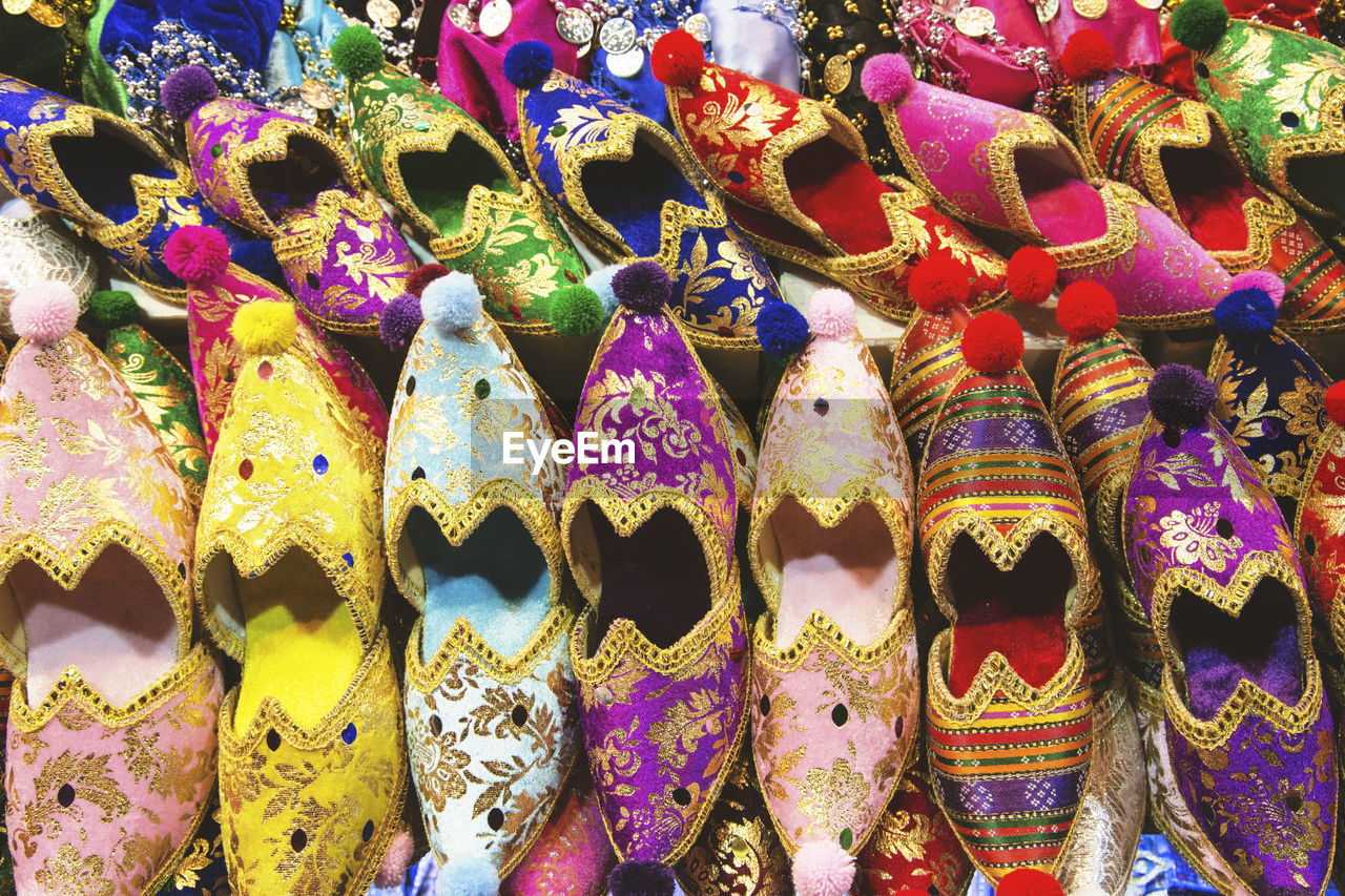 Colorful traditional shoes at market