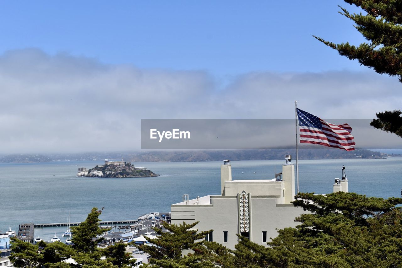 Alcatraz island sitting right beneath the fog.