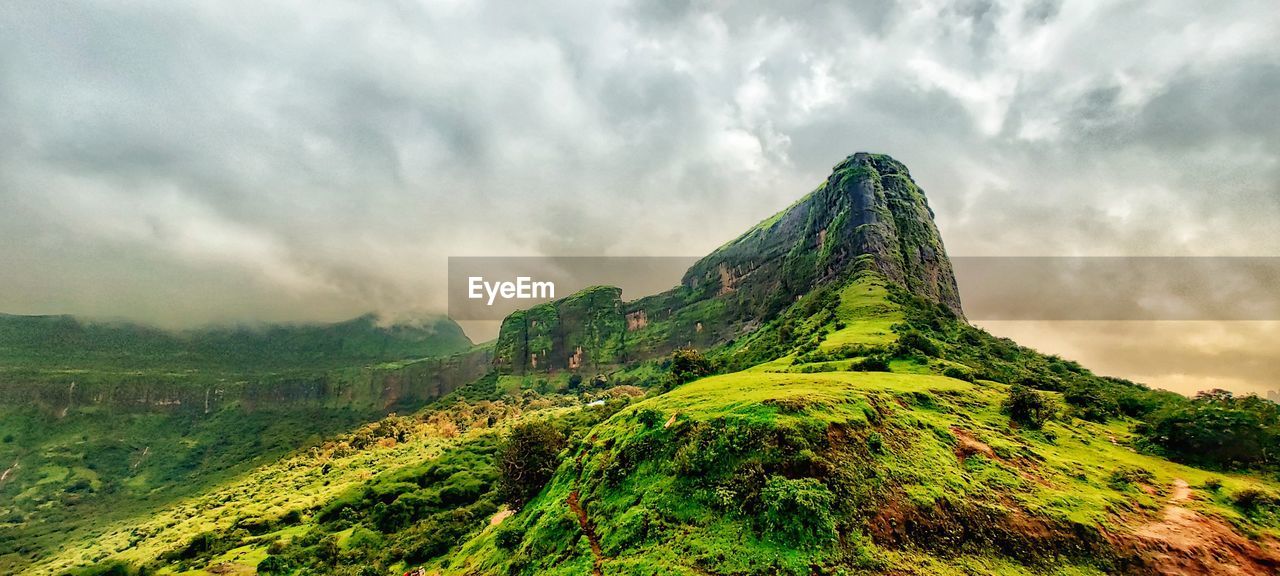 nature, environment, cloud, mountain, sky, landscape, scenics - nature, land, beauty in nature, mountain range, travel, travel destinations, fog, plant, green, panoramic, tourism, no people, mountain peak, dramatic sky, outdoors, overcast, forest, social issues, tree, tranquility, non-urban scene, plateau, environmental conservation, valley, cloudscape, rural scene, rock, wilderness