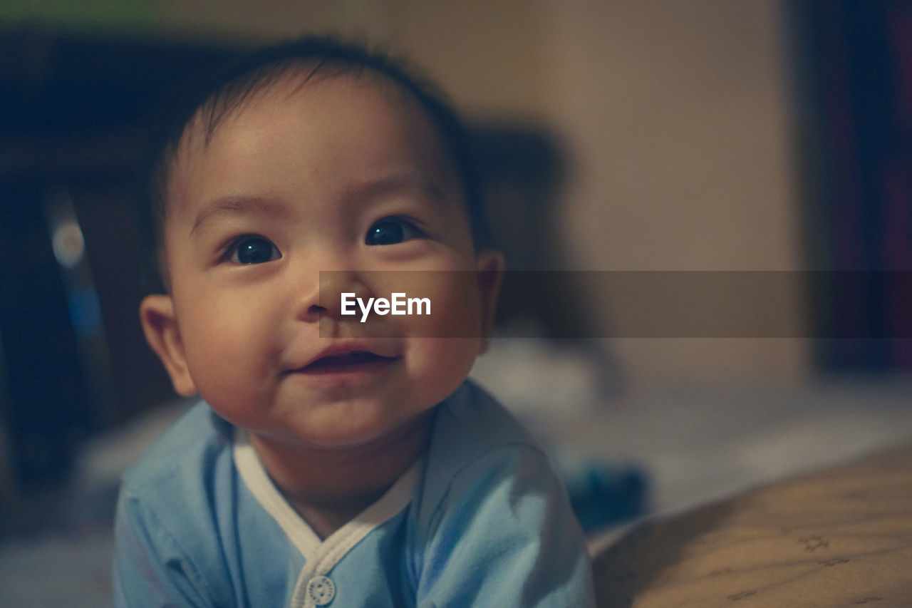Portrait of cute baby at home