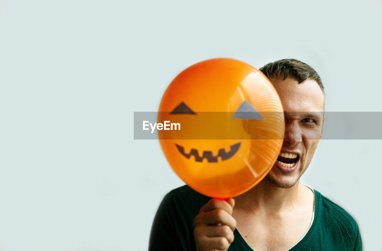 Halloween background with man making face