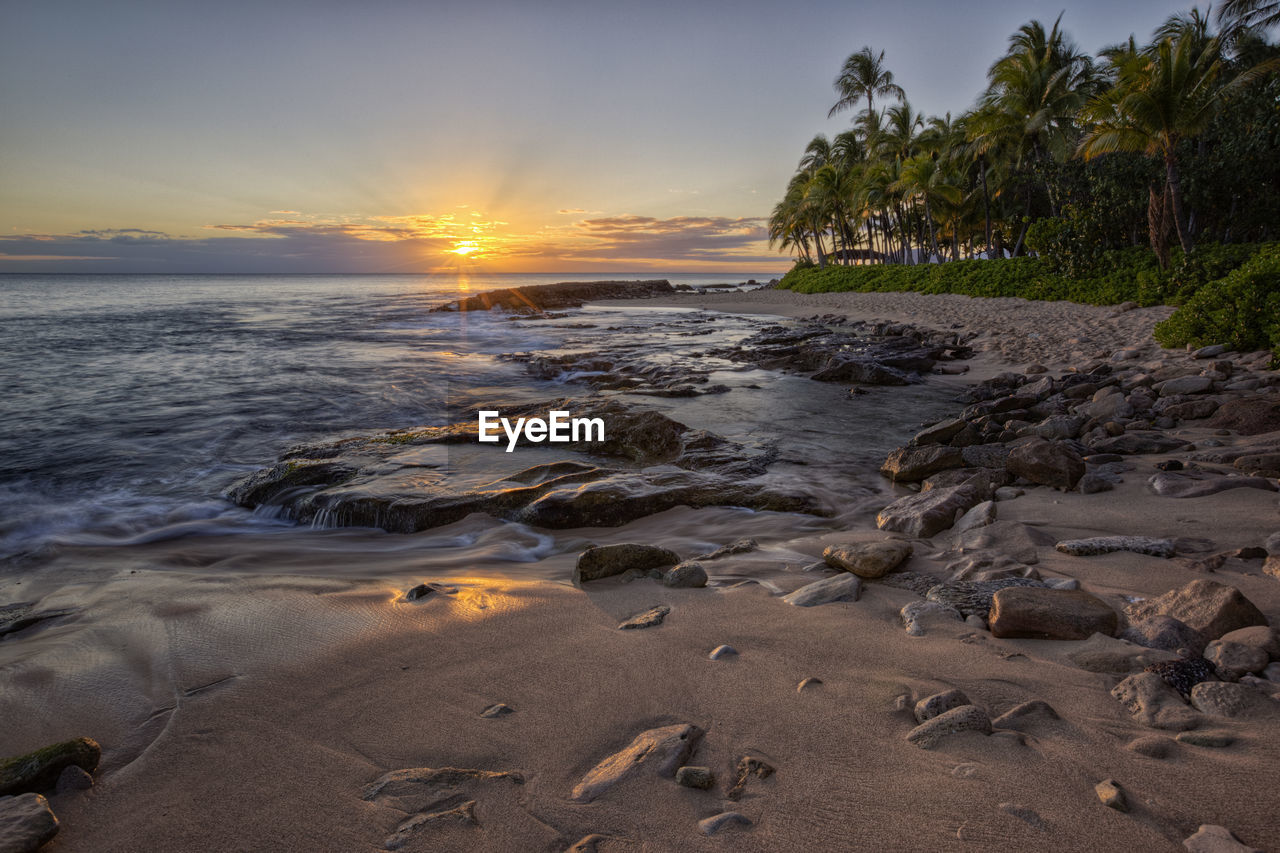 Scenic view of sea against sky during sunset