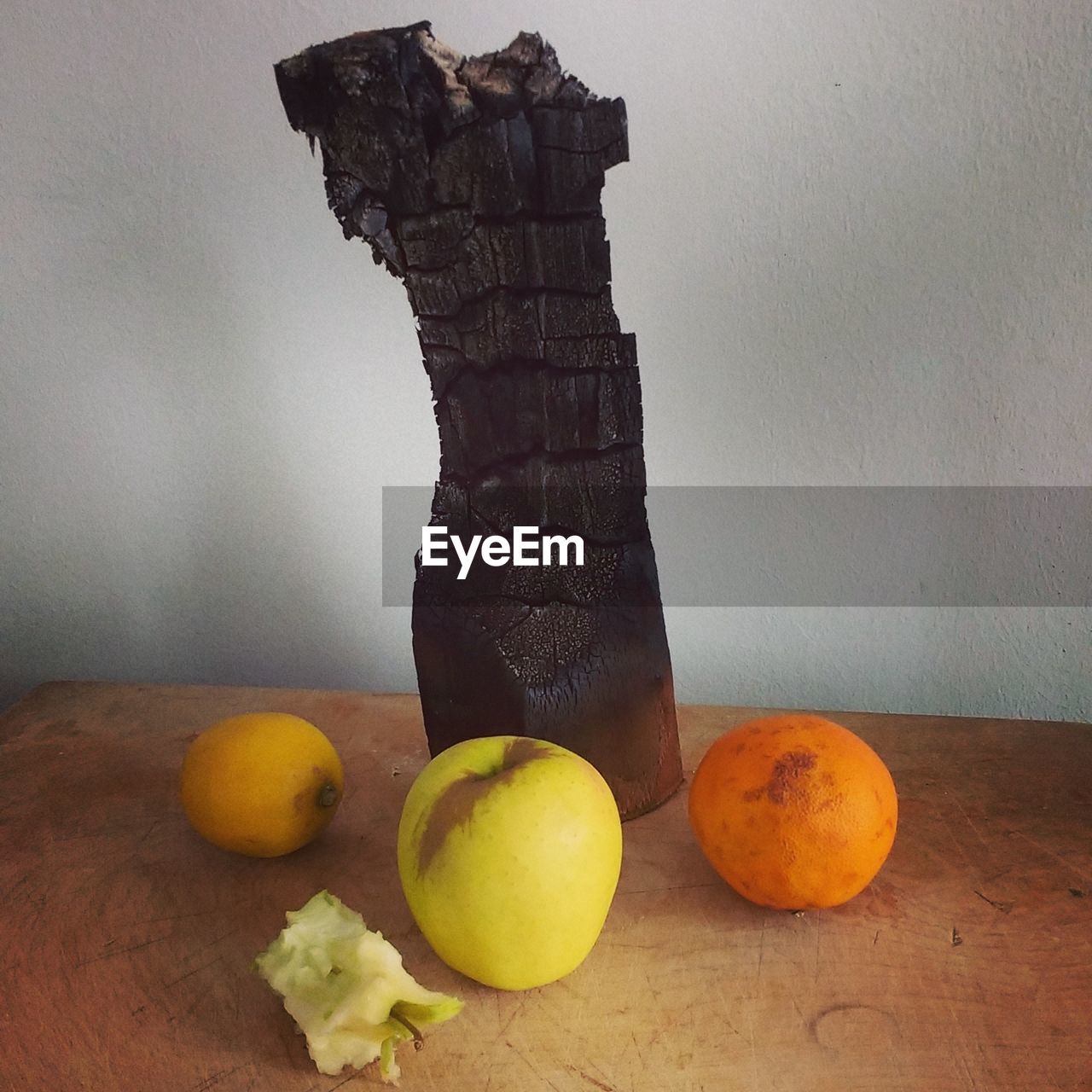 FRUITS ON TABLE AGAINST WALL