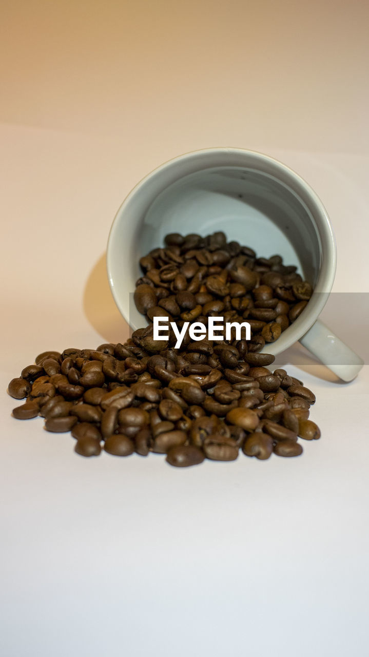 CLOSE-UP OF COFFEE BEANS IN GLASS