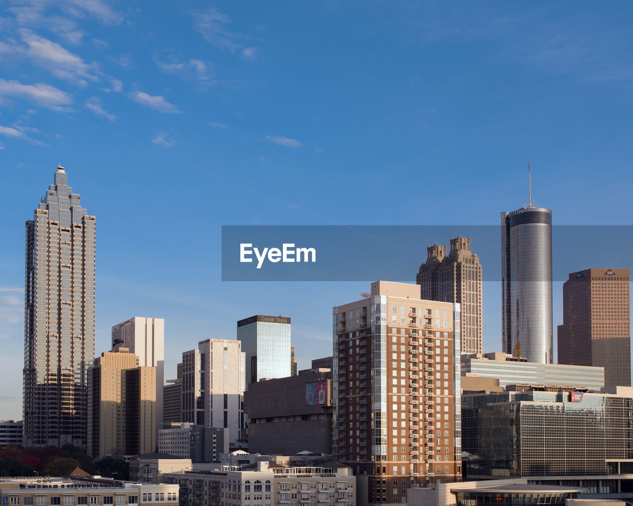 Modern buildings in city against sky