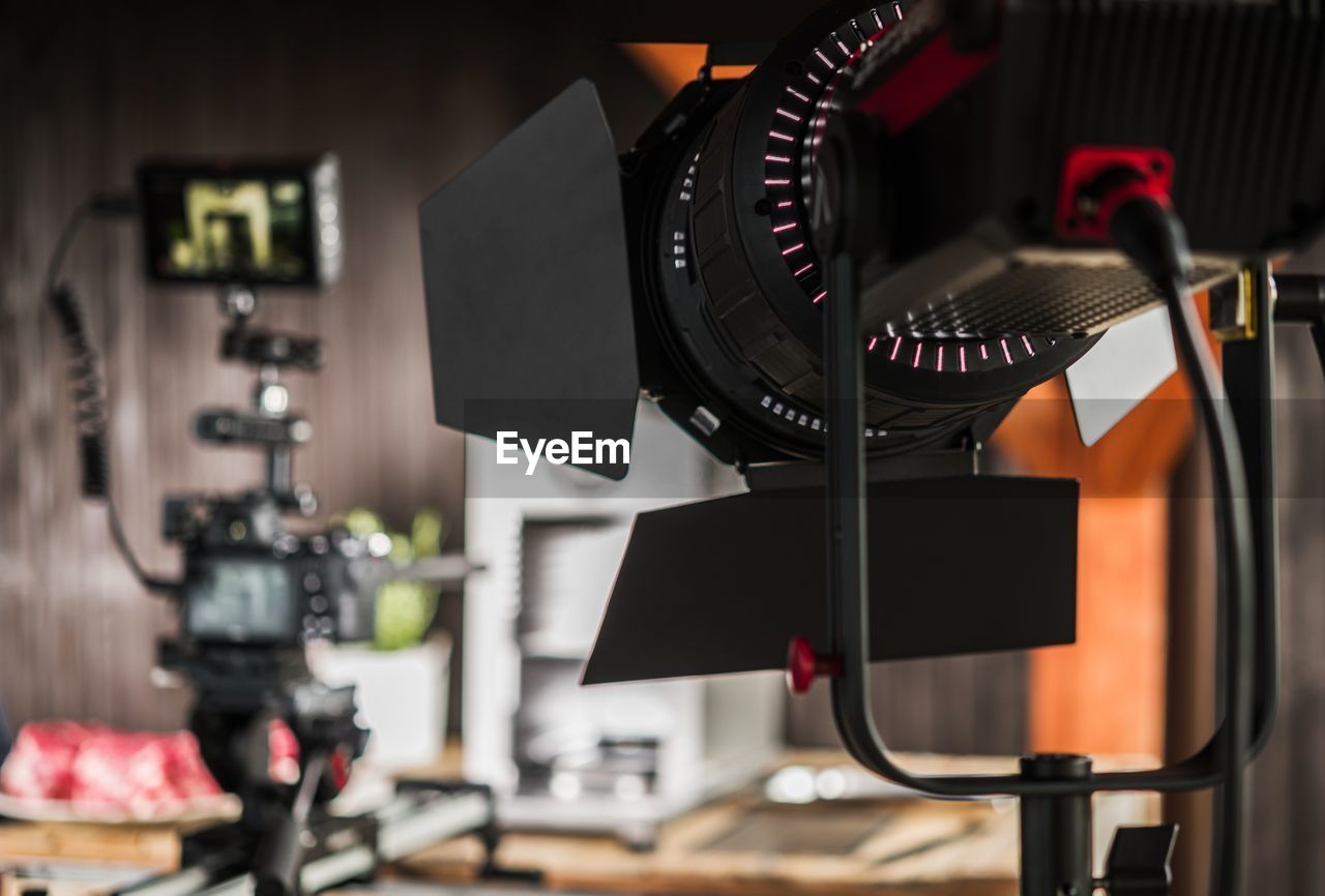 Close-up of camera with spot light at studio