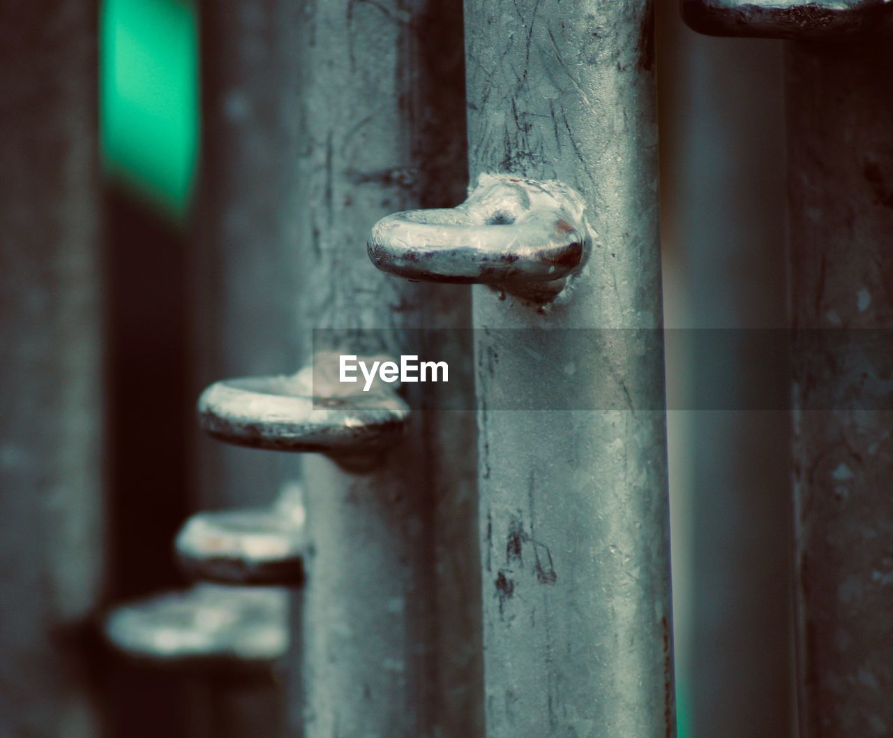 CLOSE-UP OF RUSTY METAL DOOR WITH HANDLE