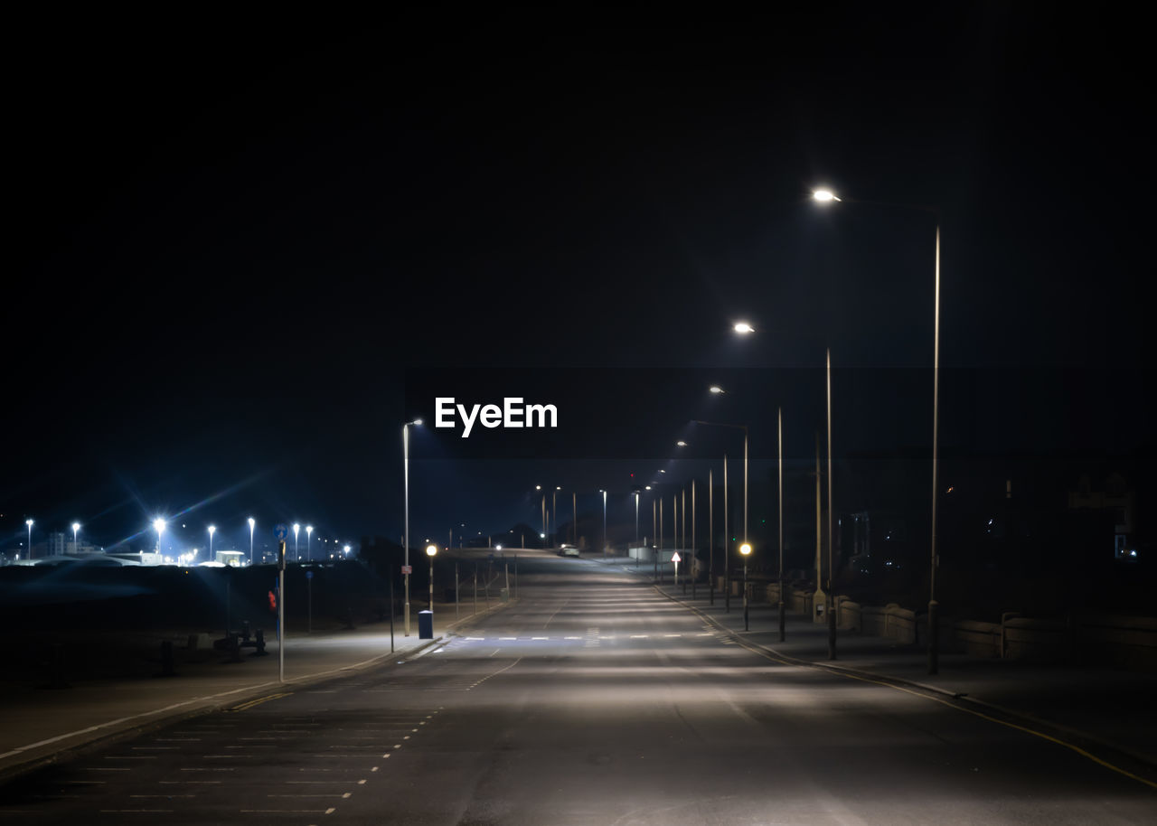 Illuminated road at night