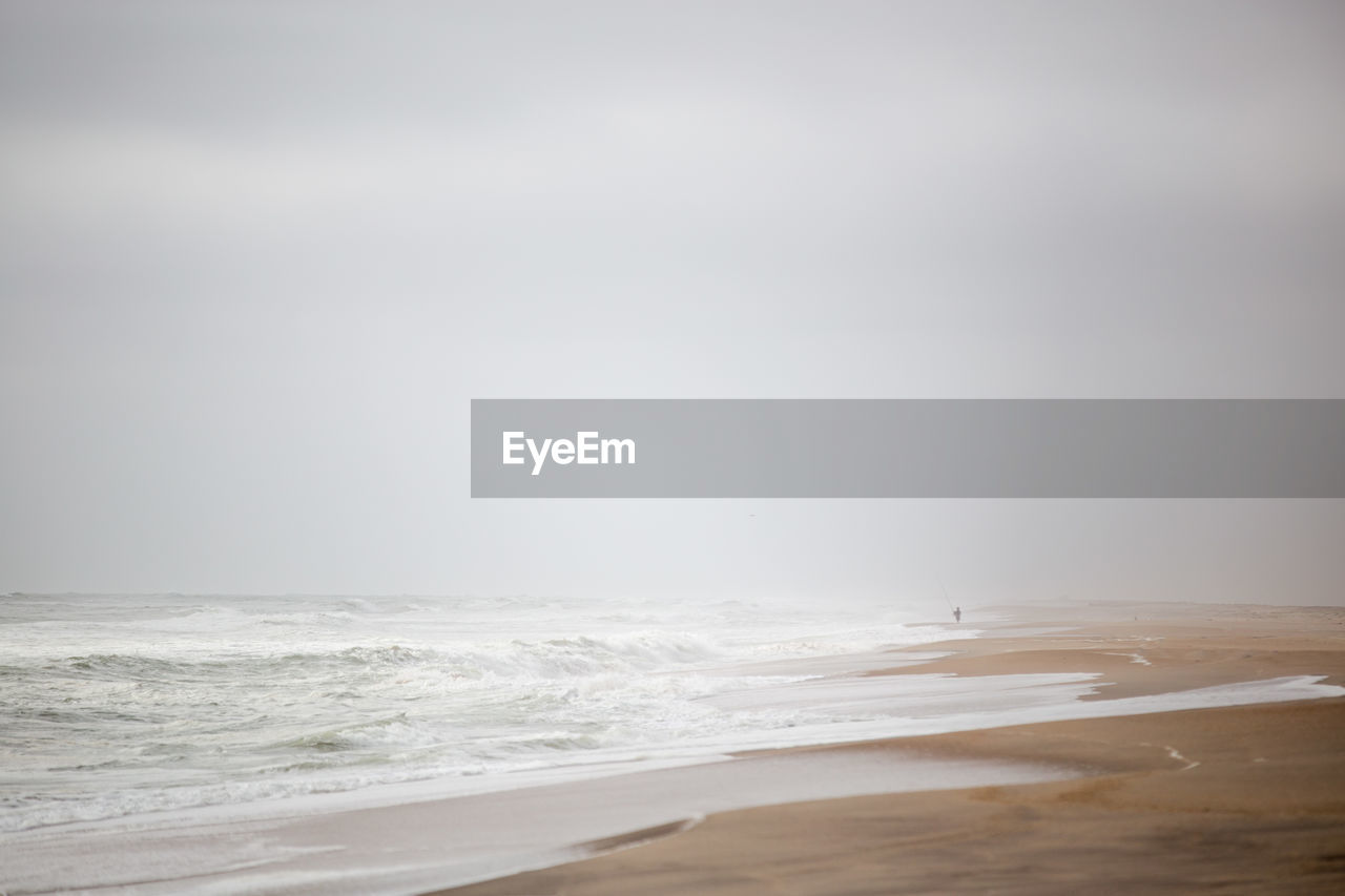 Lone person angling on the skeleton coast, namibia