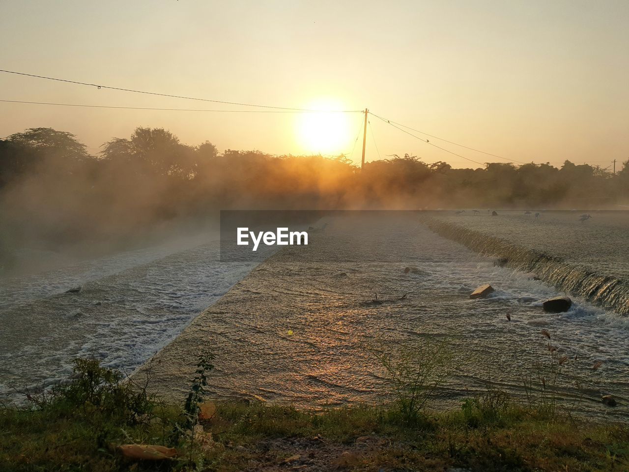 SCENIC VIEW OF LAND DURING SUNSET AGAINST SKY