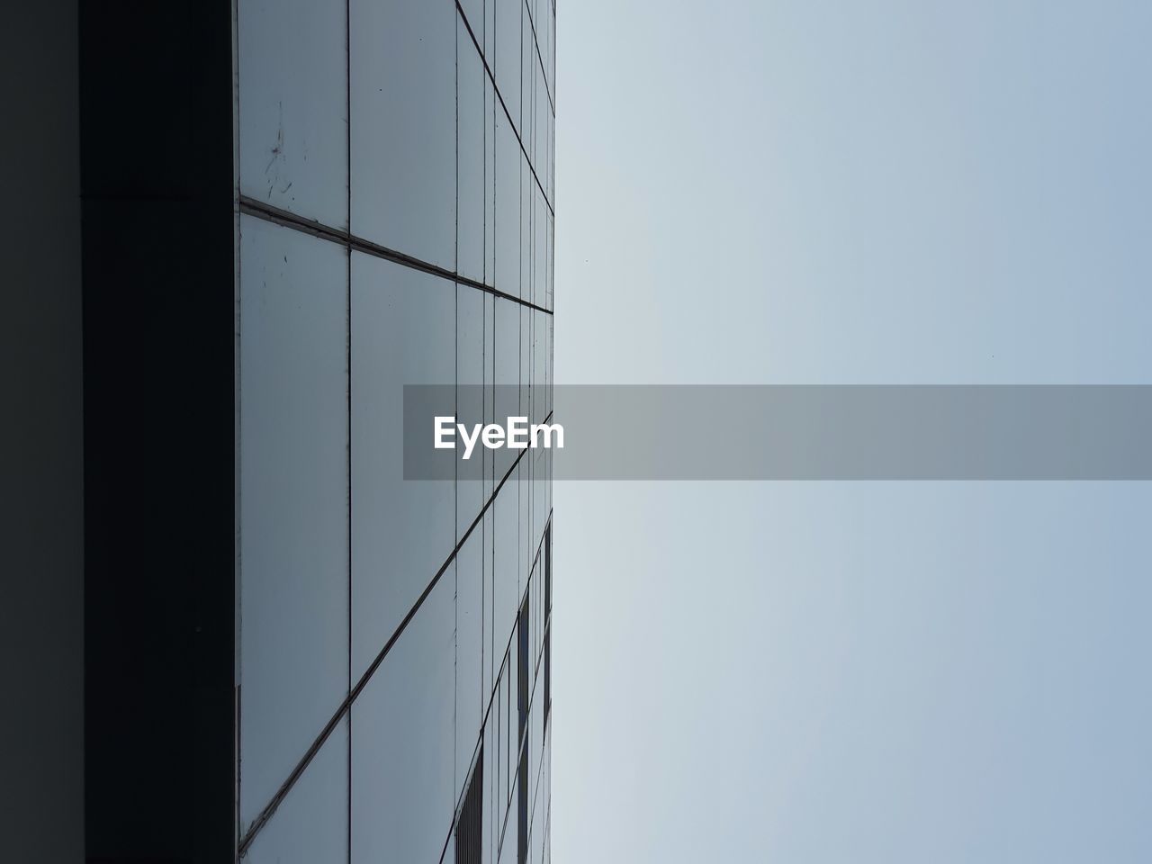 Low angle view of modern building against clear sky