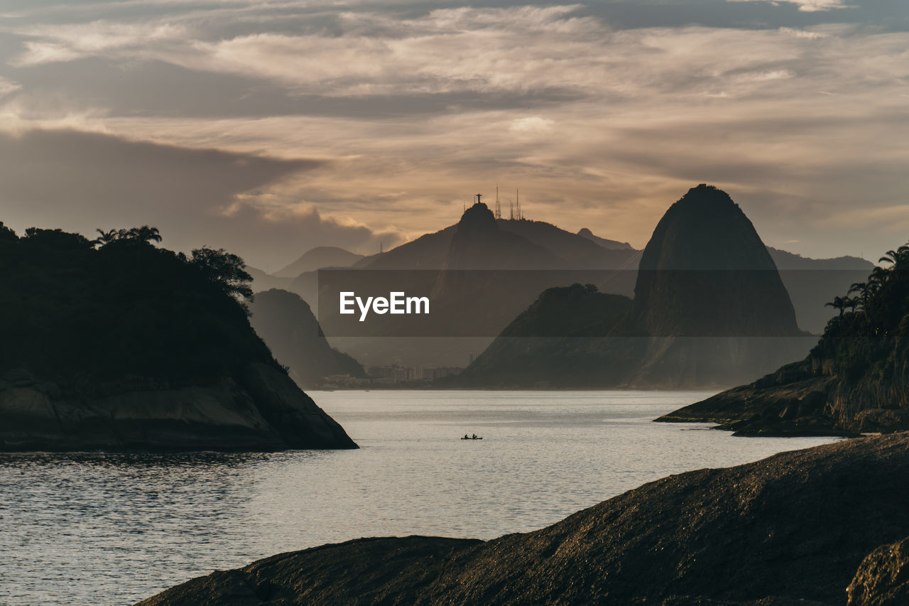 Scenic view of sea against cloudy sky