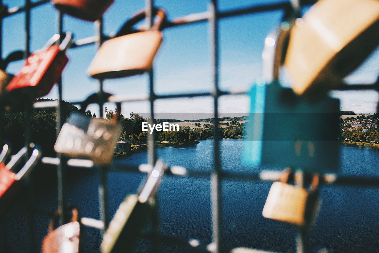 River seen through railing with love locks