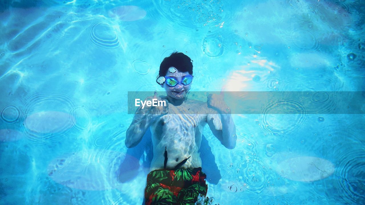 High angle view of boy in swimming pool