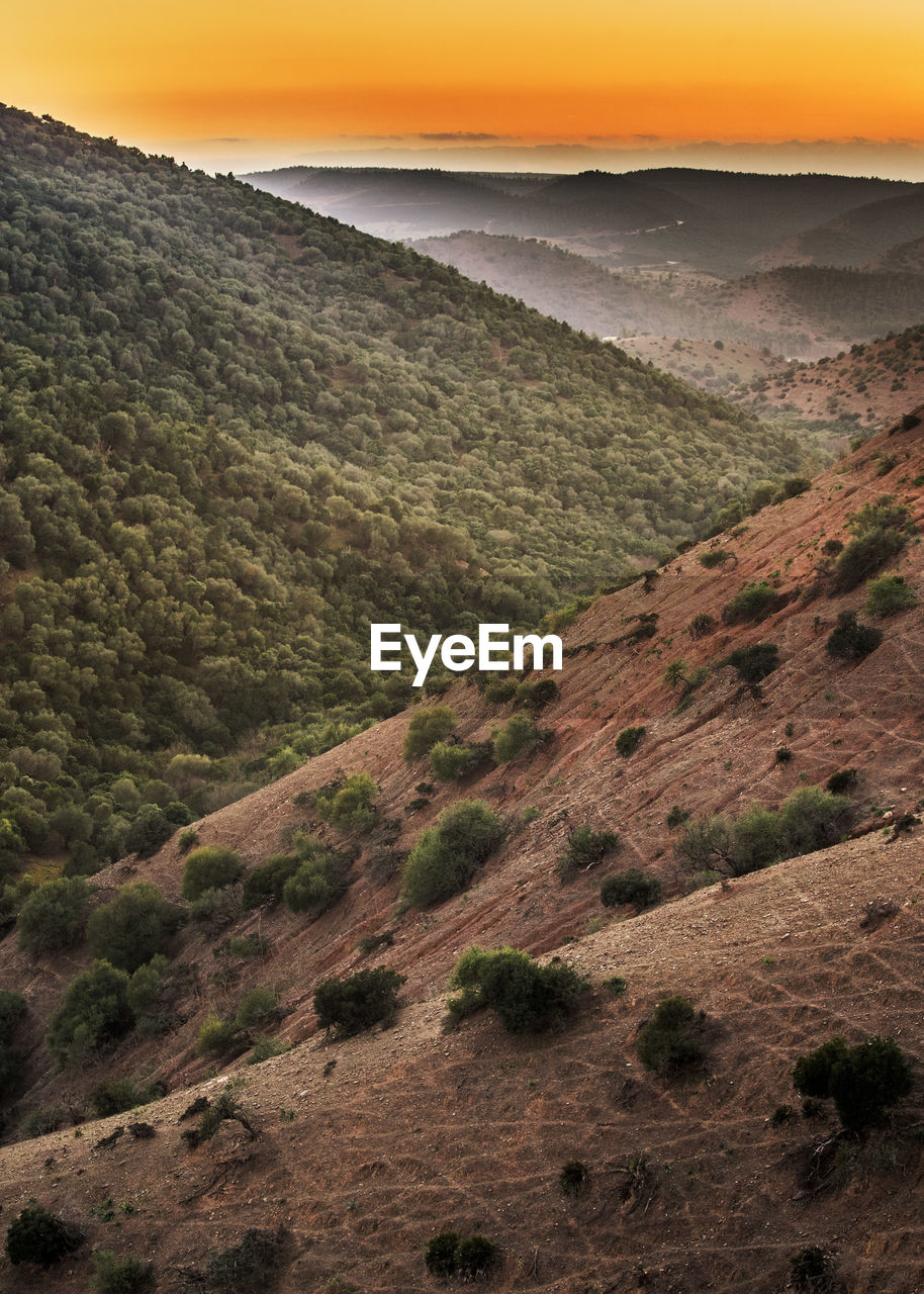 Scenic view of mountains at sunset