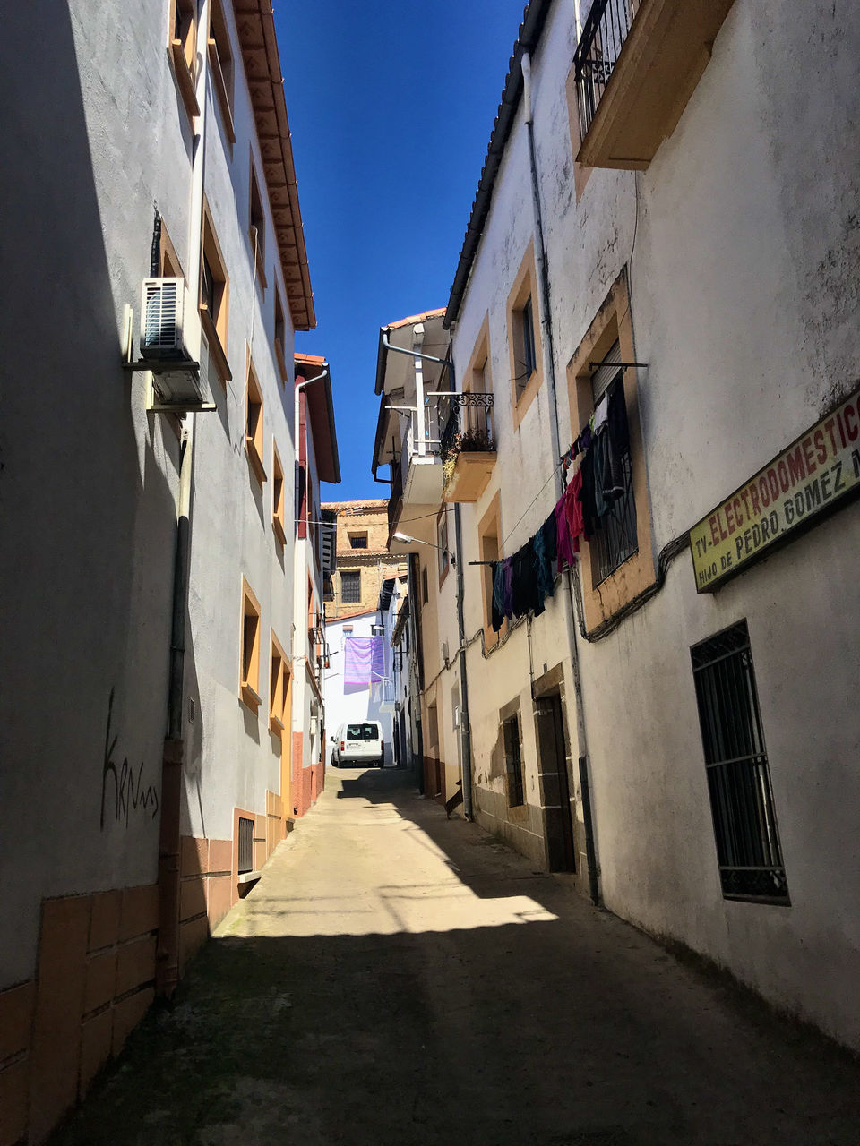 Narrow street amidst buildings in town