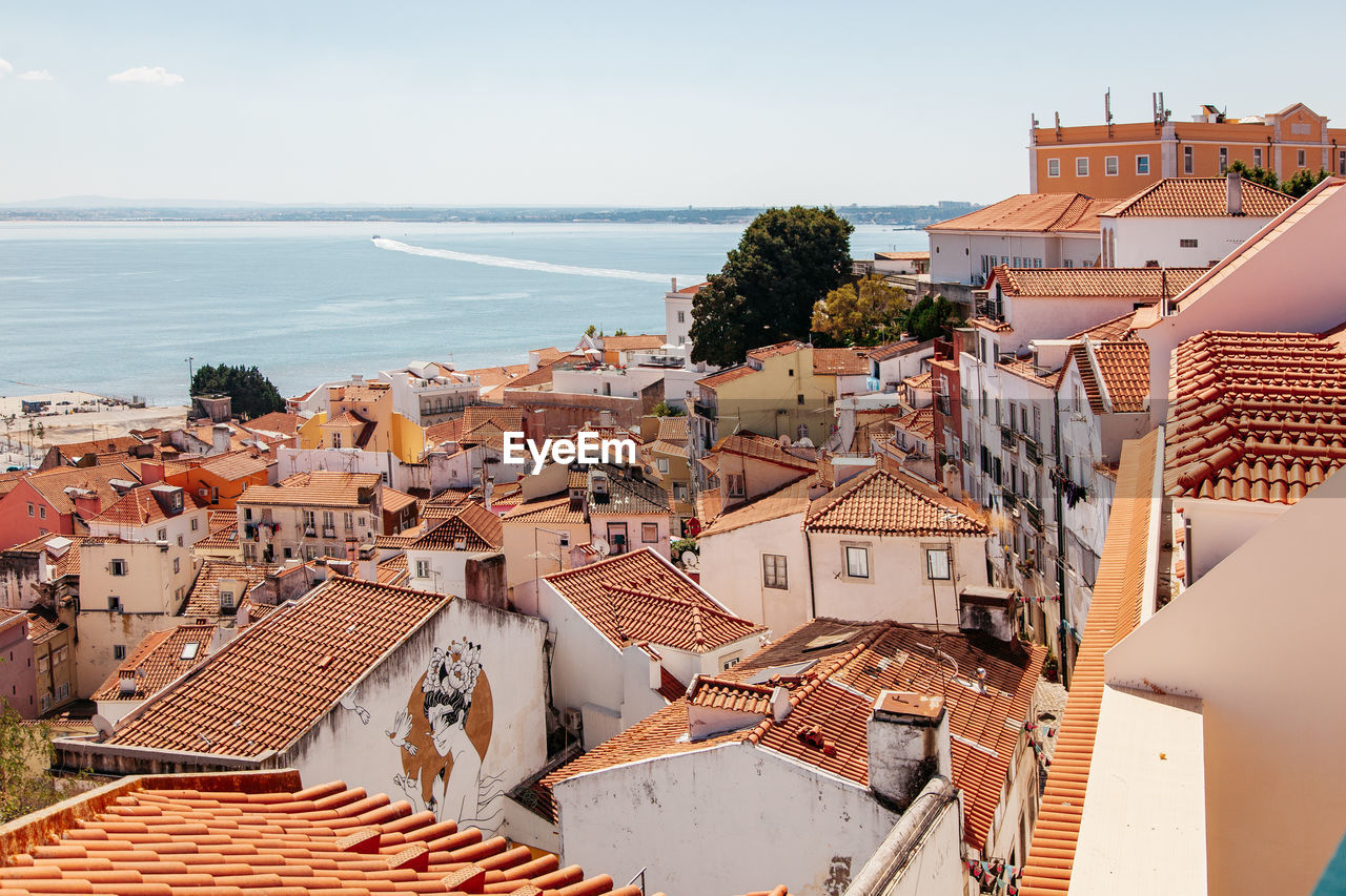 High angle view of lisbon by the tejo river against sky