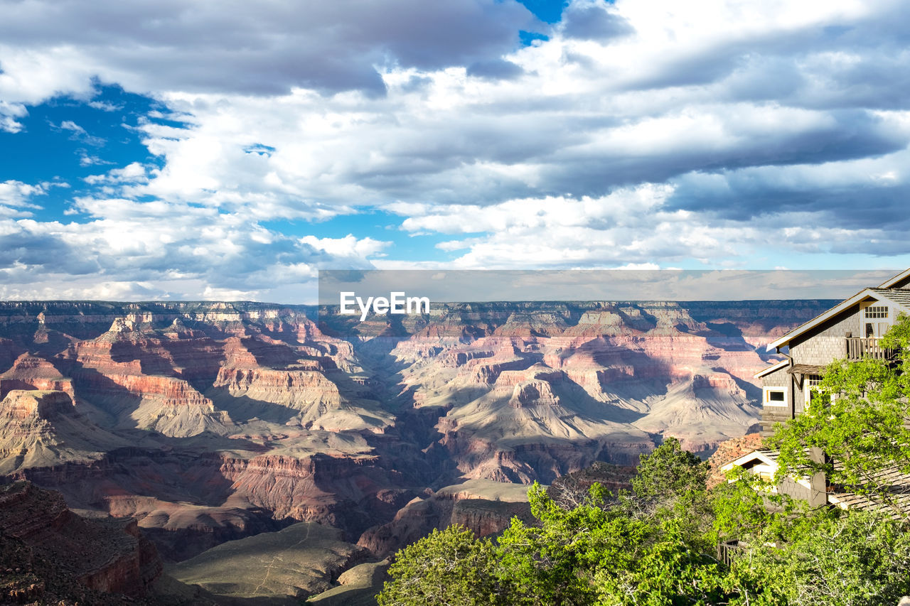 Scenic view of rock formations at grand canyon against cloudy sky