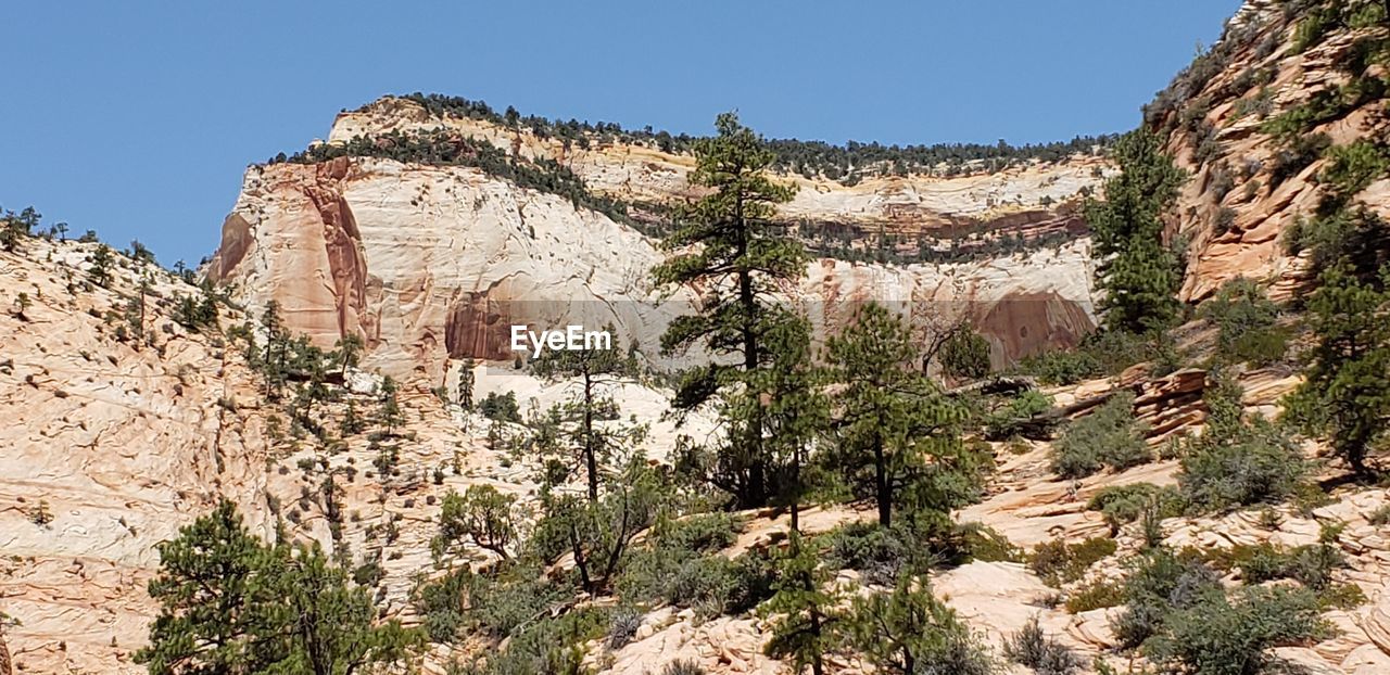 LOW ANGLE VIEW OF ROCK FORMATIONS