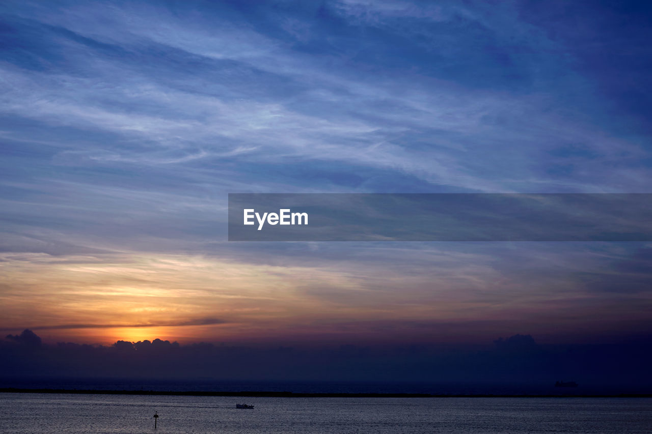 Scenic view of sea at sunset