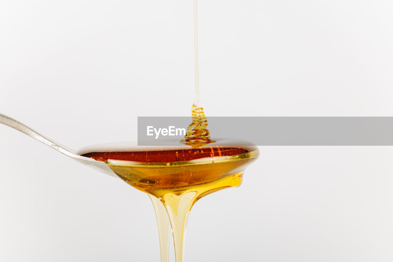 food and drink, drink, refreshment, alcoholic beverage, alcohol, distilled beverage, pouring, martini, studio shot, cocktail, glass, indoors, white background, food, household equipment, no people, drinking glass