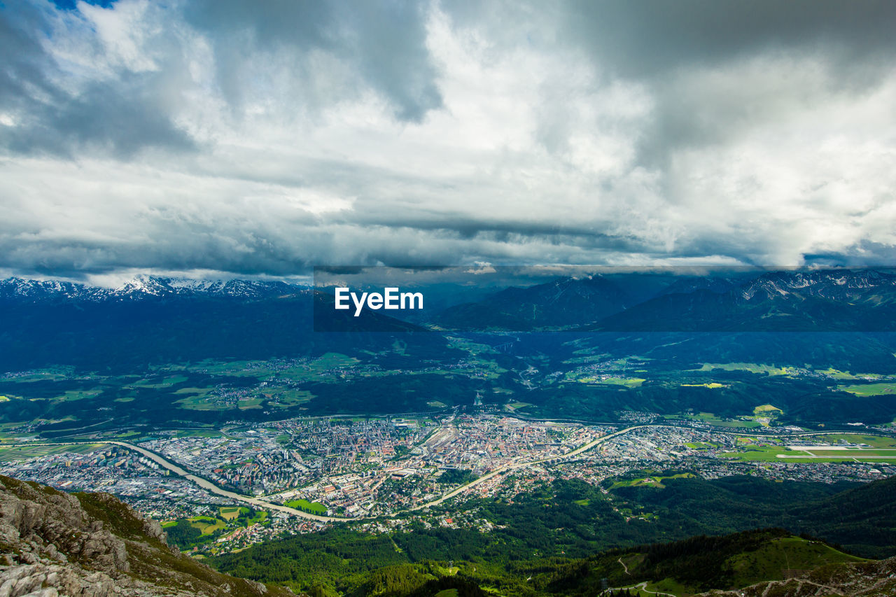 Scenic view of alps against cloudy sky