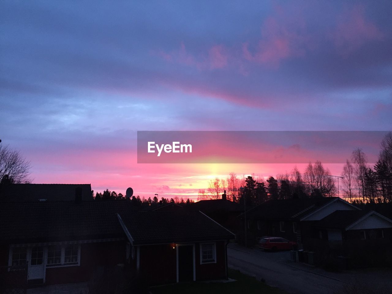 SILHOUETTE OF HOUSE AT SUNSET