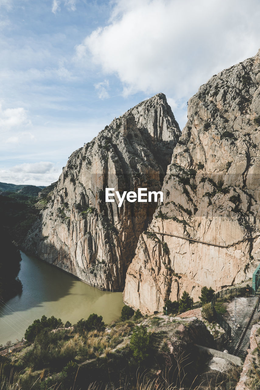 Scenic view of rocks in mountains against sky