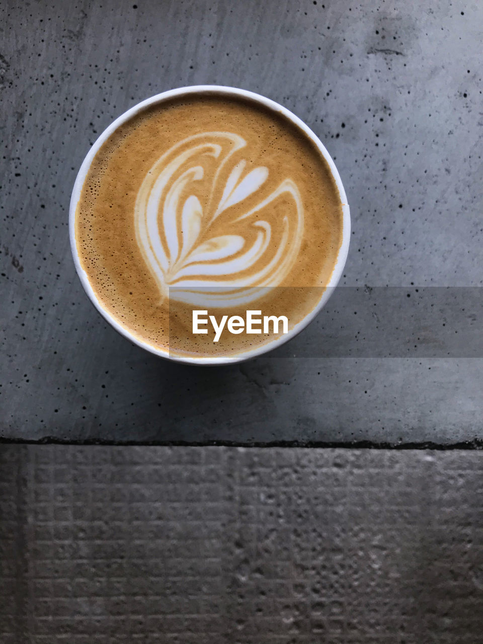 A cup of latte art in coffee shop