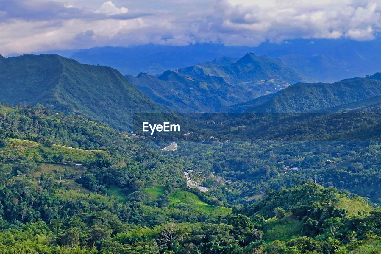 SCENIC VIEW OF MOUNTAIN RANGE AGAINST SKY