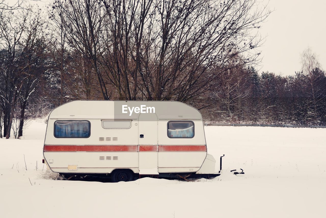 Travel trailer on snow covered field