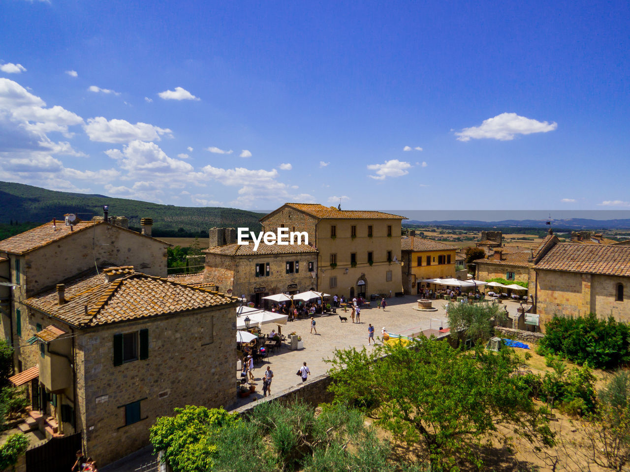 high angle view of buildings in town against sky