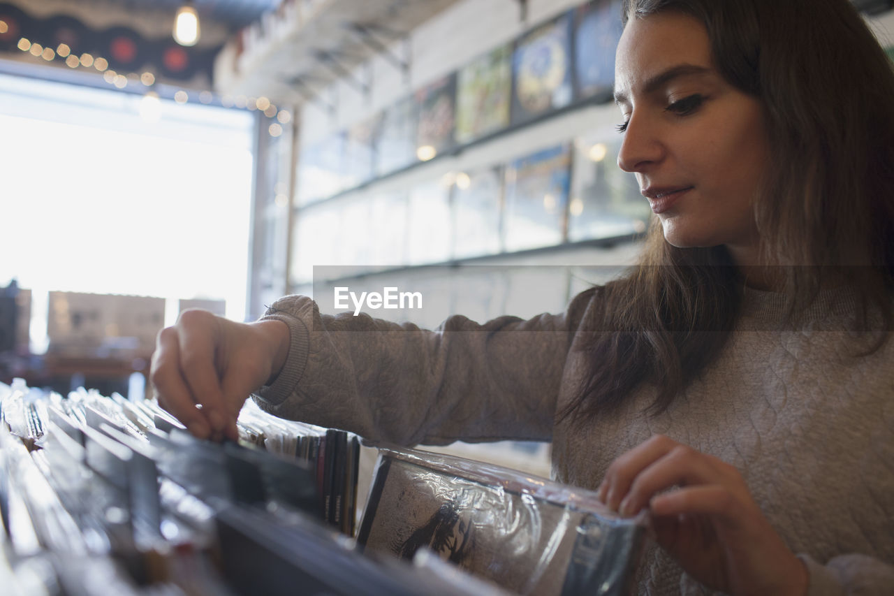 Young woman in a record store.