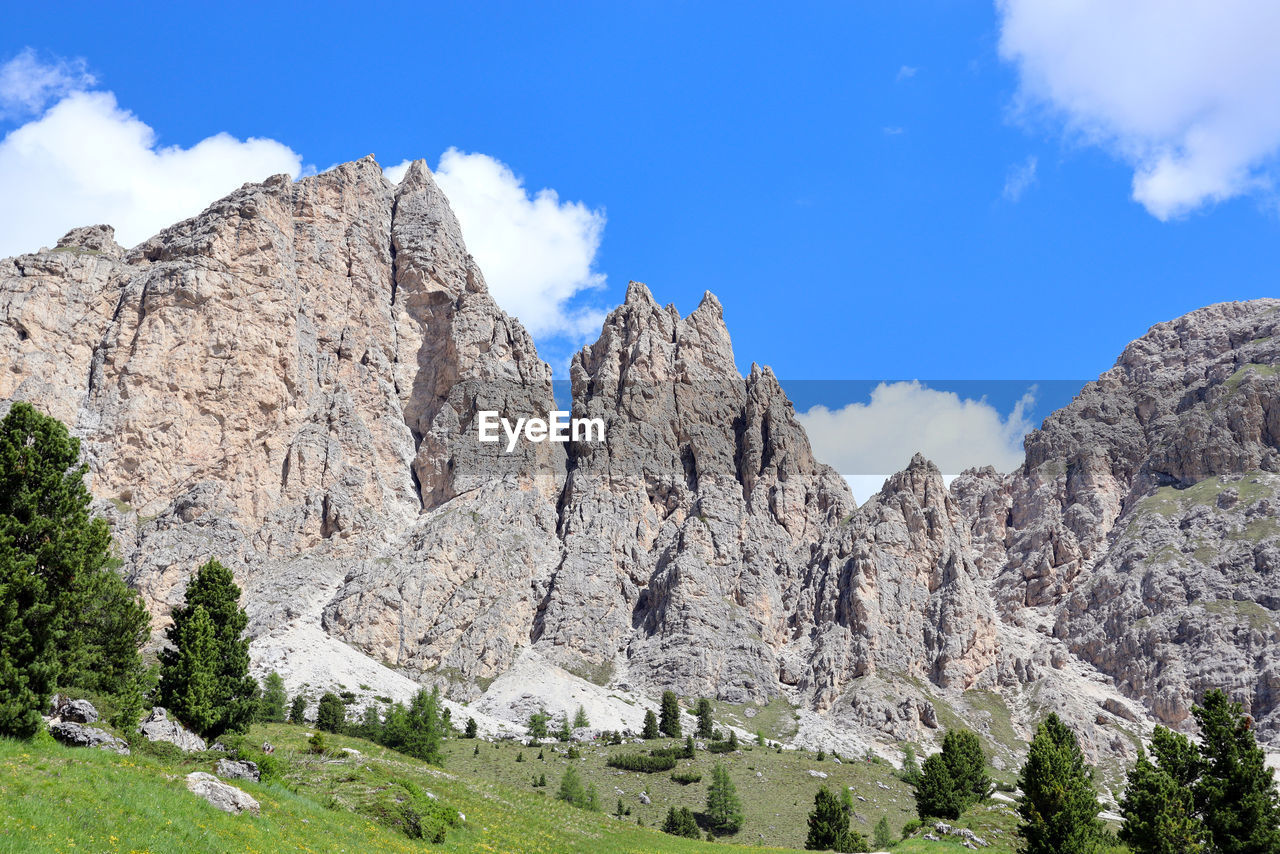 Low angle view,  against sky, of the cir mountain group standing over gardena pass in the dolomites.