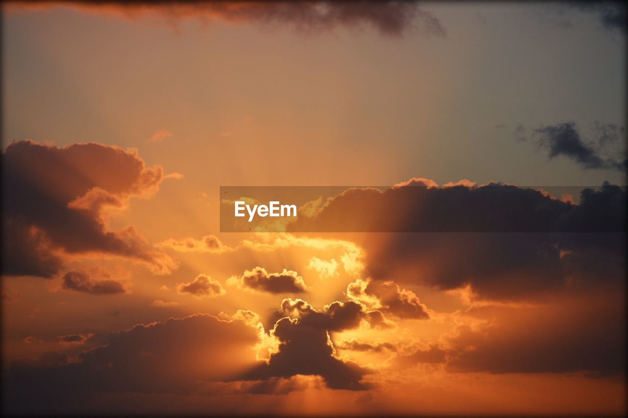 Low angle view of cloudy sky during sunset