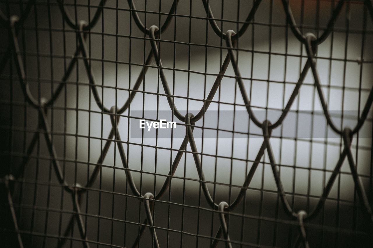 CLOSE-UP OF BARBED WIRE FENCE