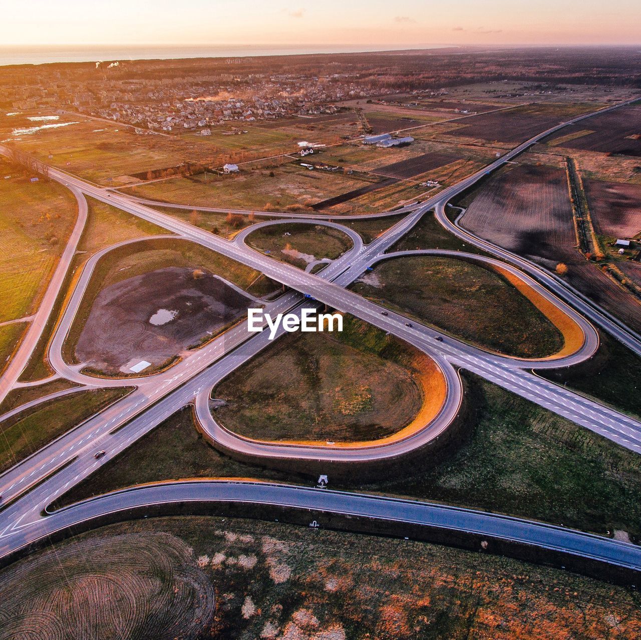 HIGH ANGLE VIEW OF HIGHWAY SEEN FROM AIRPLANE