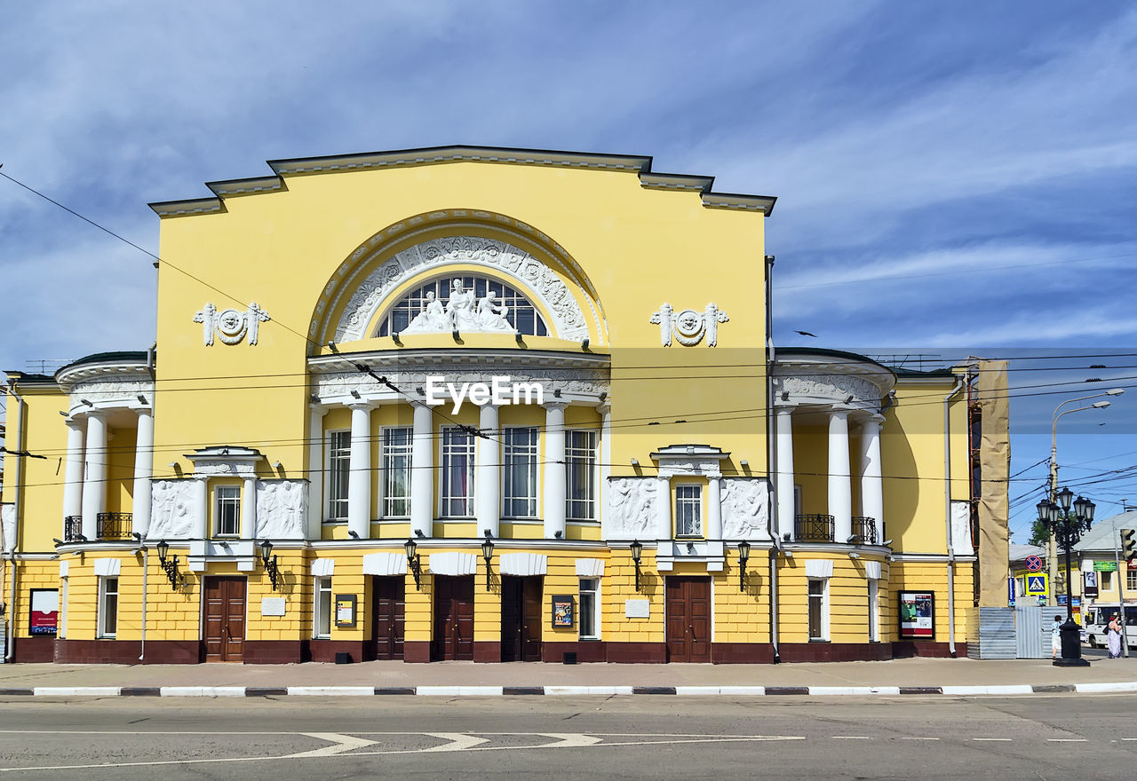 LOW ANGLE VIEW OF YELLOW BUILDING