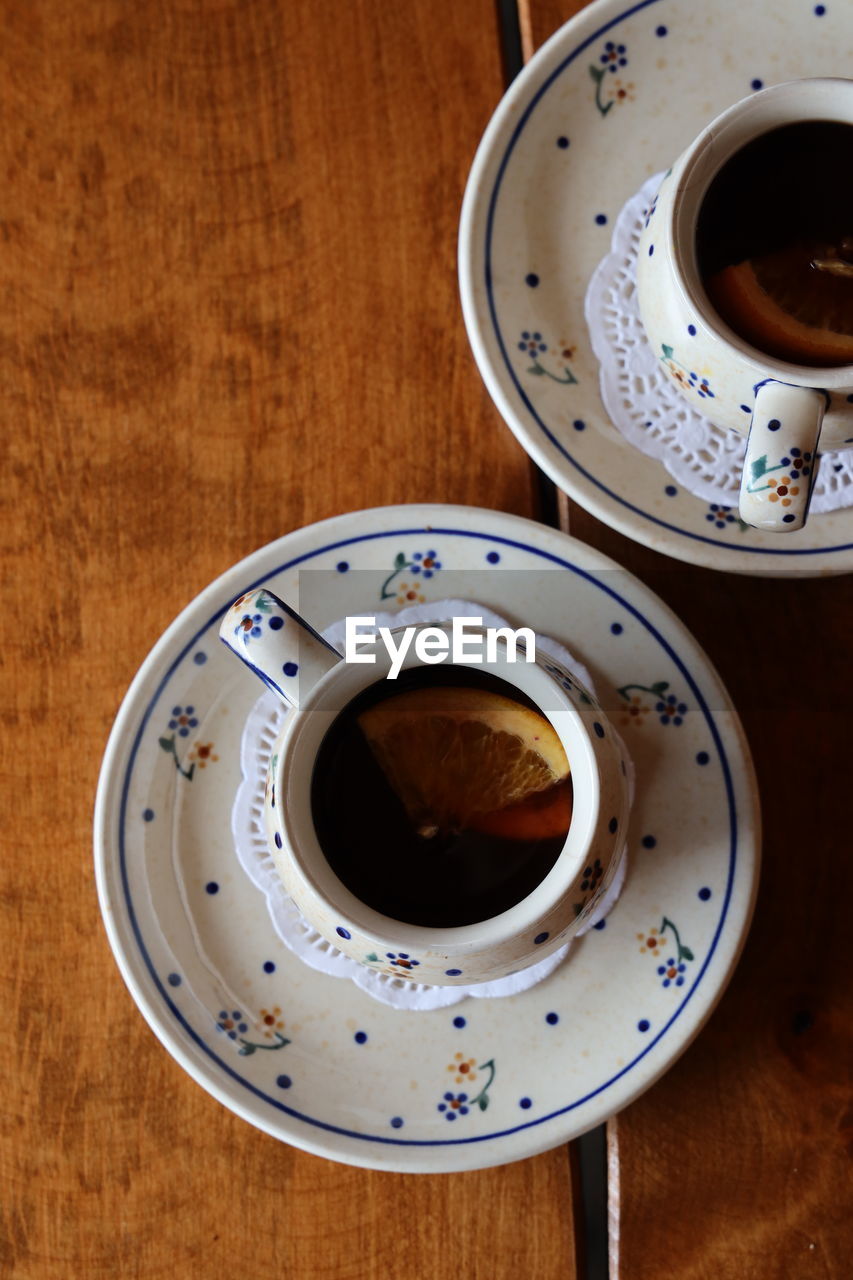 HIGH ANGLE VIEW OF COFFEE CUP WITH TEA