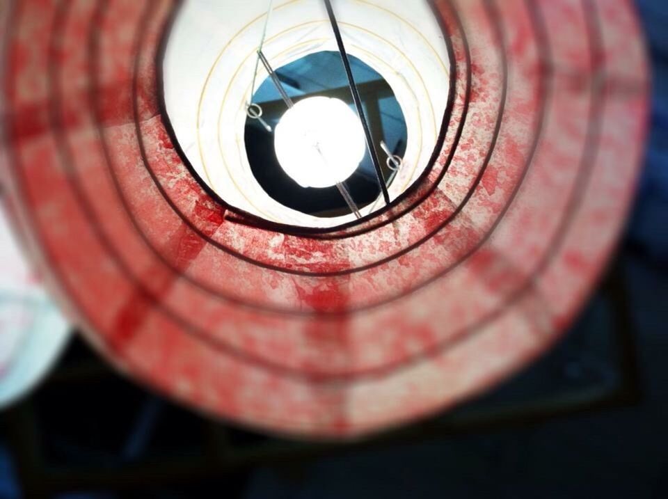 CLOSE-UP OF RED OBJECT ON WALL