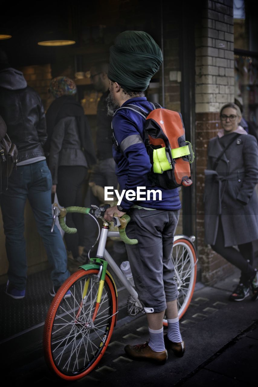 PEOPLE RIDING BICYCLES ON STREET