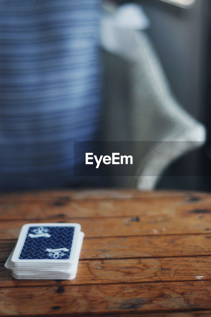 Close-up of cards on wooden table