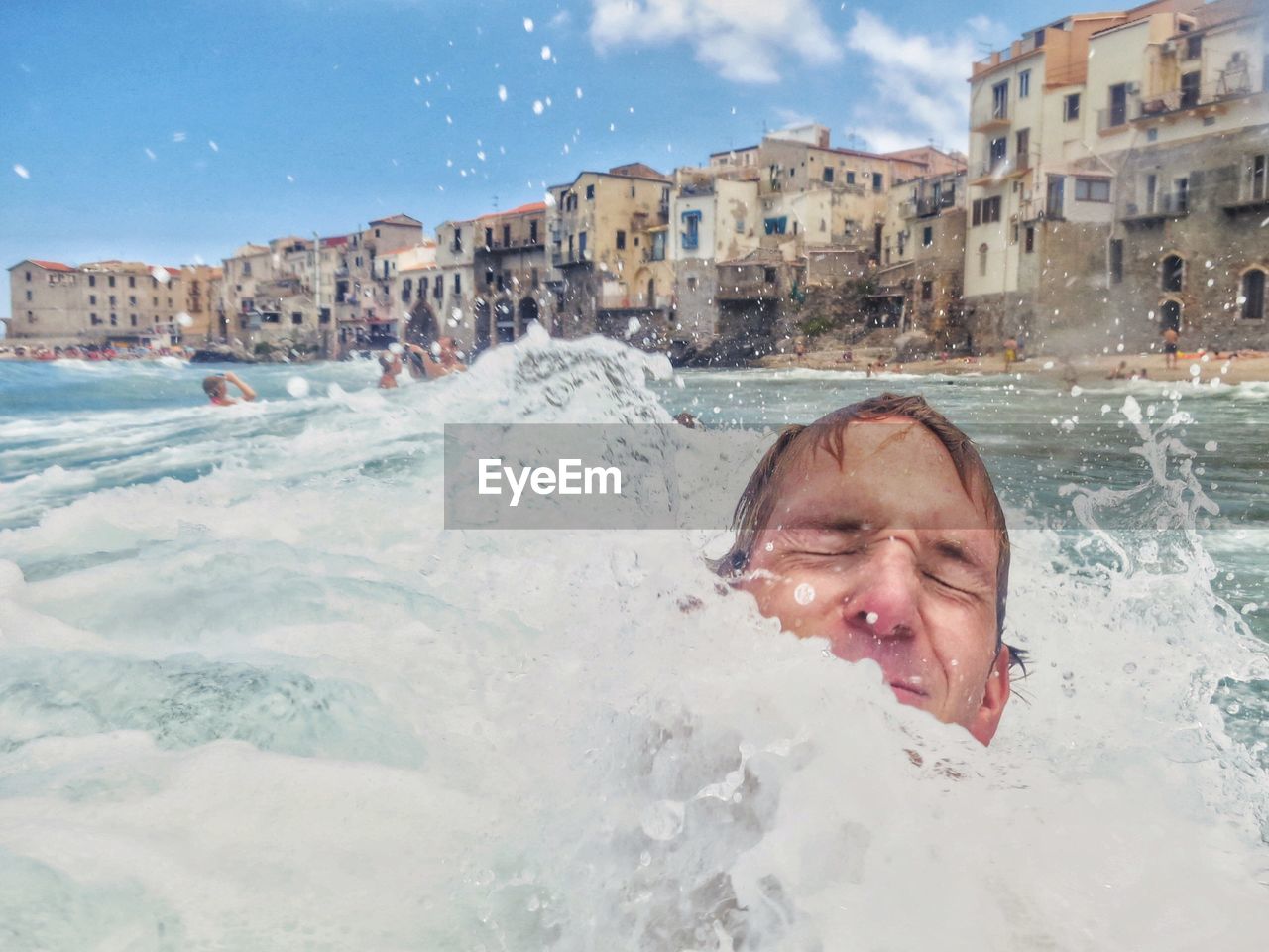 Man swimming in water