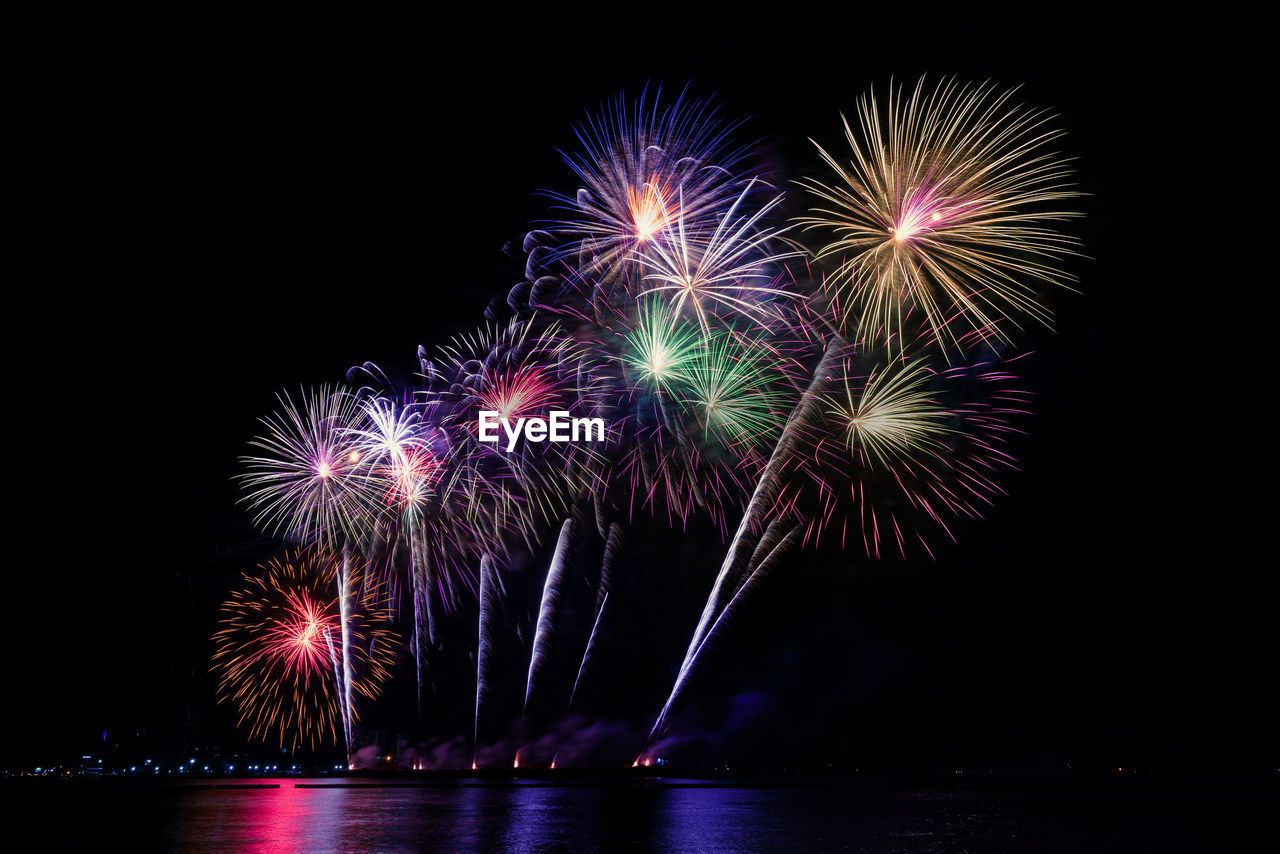 Colorful fireworks of various colors at night with celebration and anniversary concept.